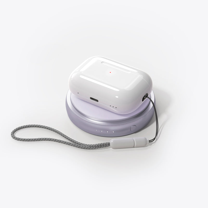 PETL MagSafe battery pack in lavender with charging cable and wrist strap, displayed against white background.