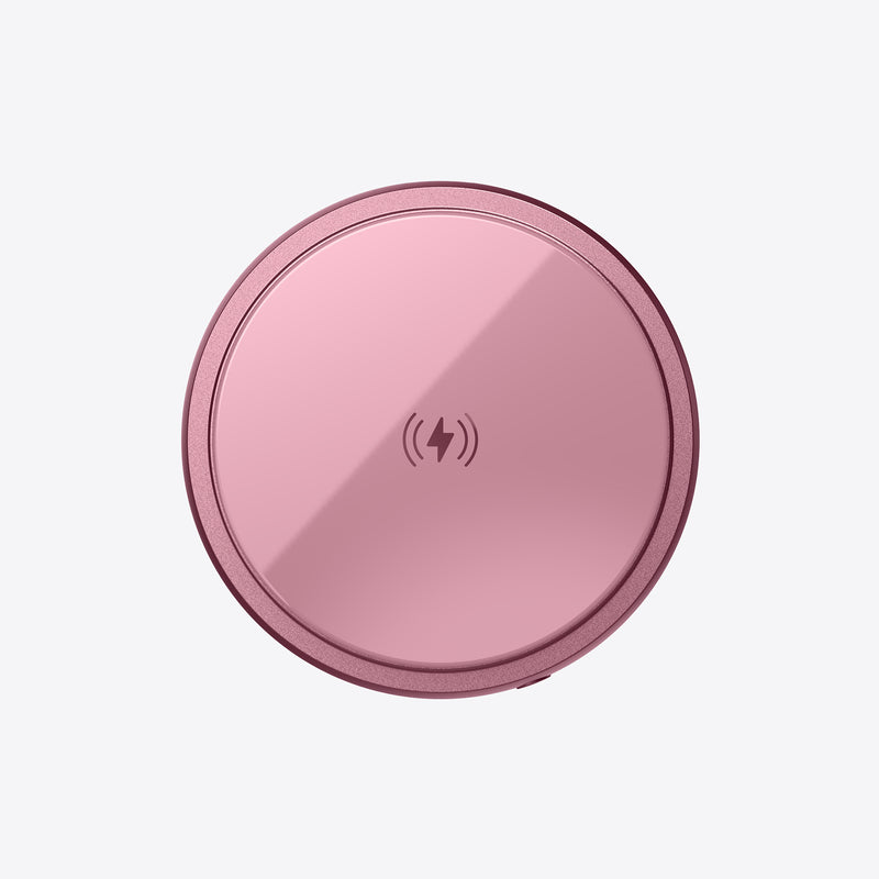 Pink PETL wireless charging pad with MagSafe compatibility and charging icon displayed on surface.