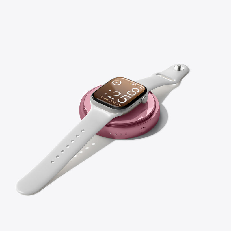 PETL MagSafe battery pack in burgundy attached to white Apple Watch showing 2:08 on display.