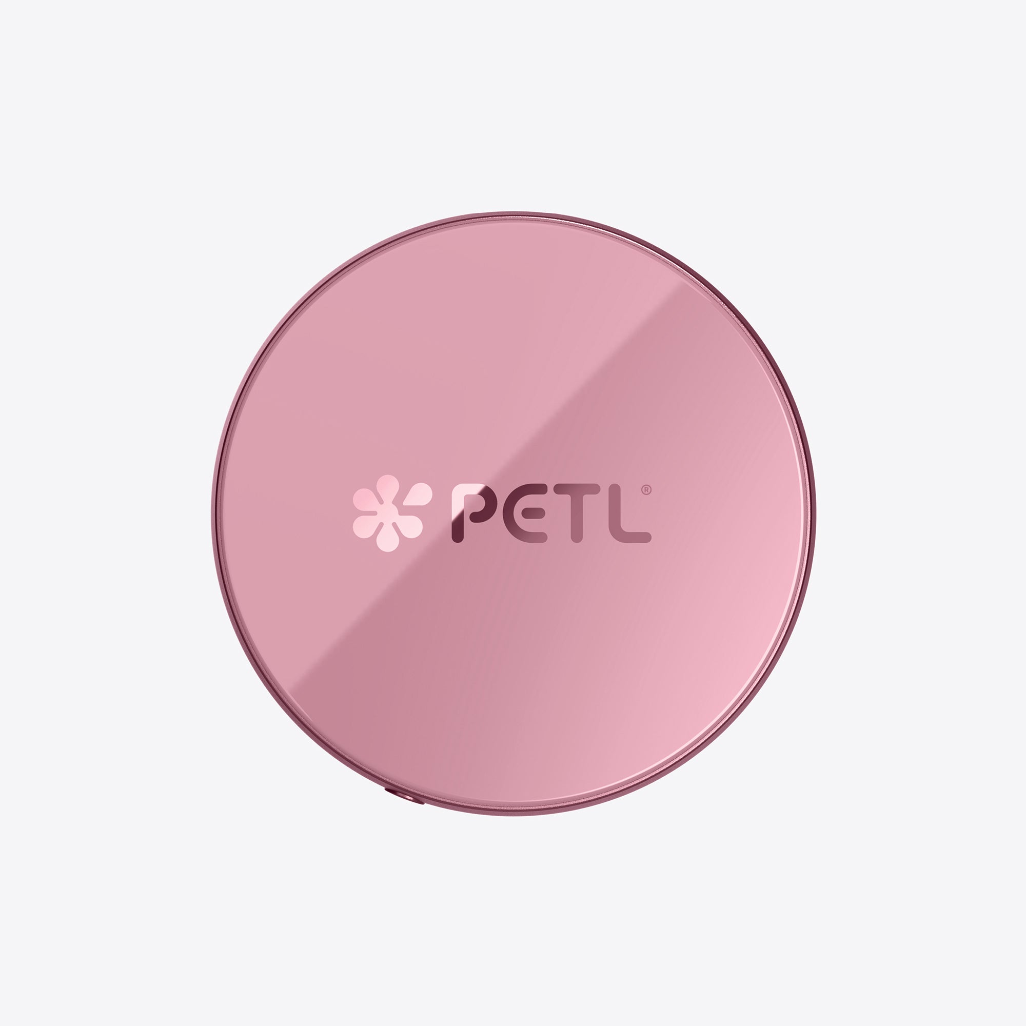 PETL MagSafe battery pack in pink with logo displayed on the circular device.
