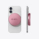 PETL MagSafe battery pack in mauve pink shown front and side view attached to a white smartphone.