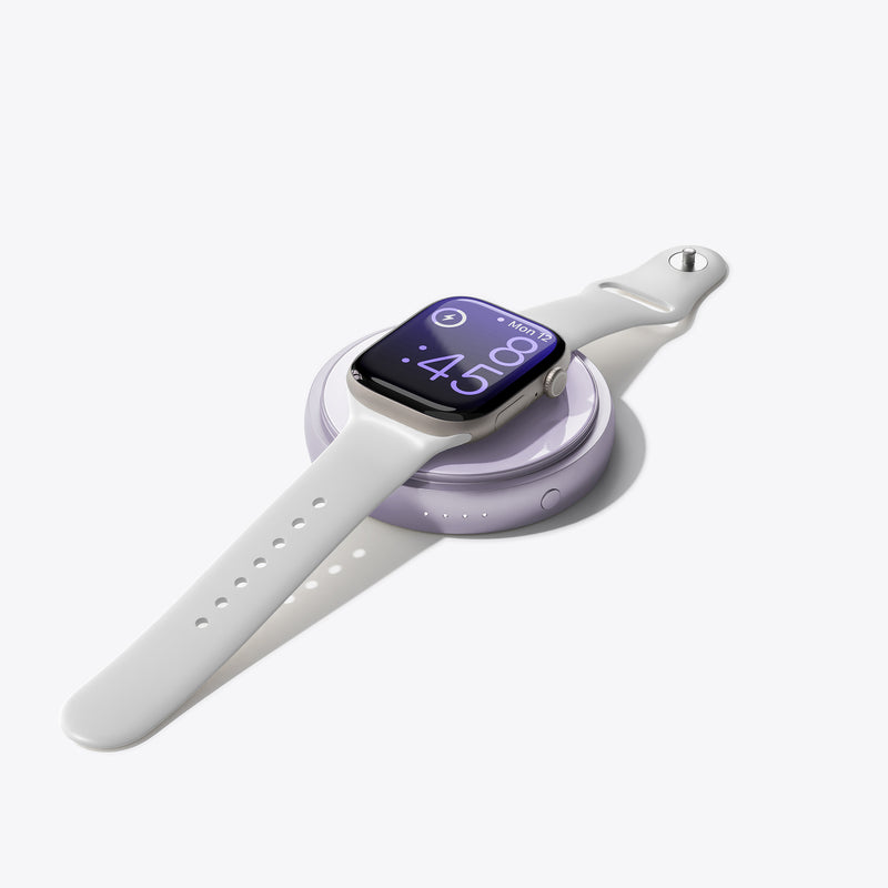 White PETL MagSafe battery pack with purple charging case displayed on white smartwatch band showing 4:09 time.